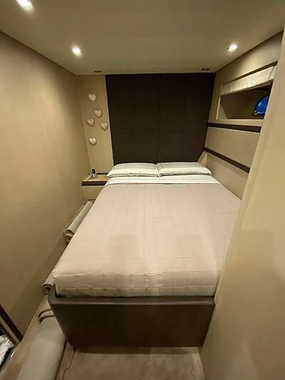 a bed with a white sheet aboard @LAST Yacht for Sale