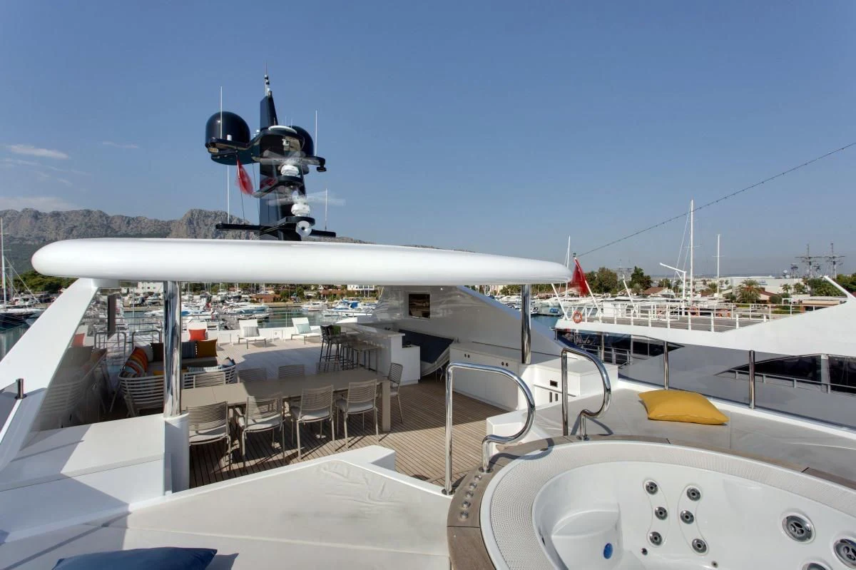 a large white airplane with a propeller on it aboard BEBE Yacht for Sale