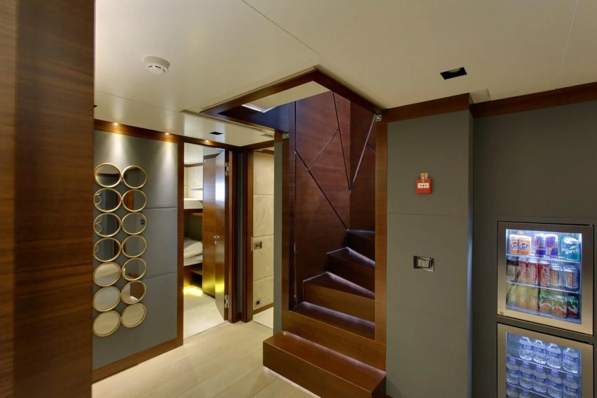 a hallway with a staircase and a glass door aboard BEBE Yacht for Sale
