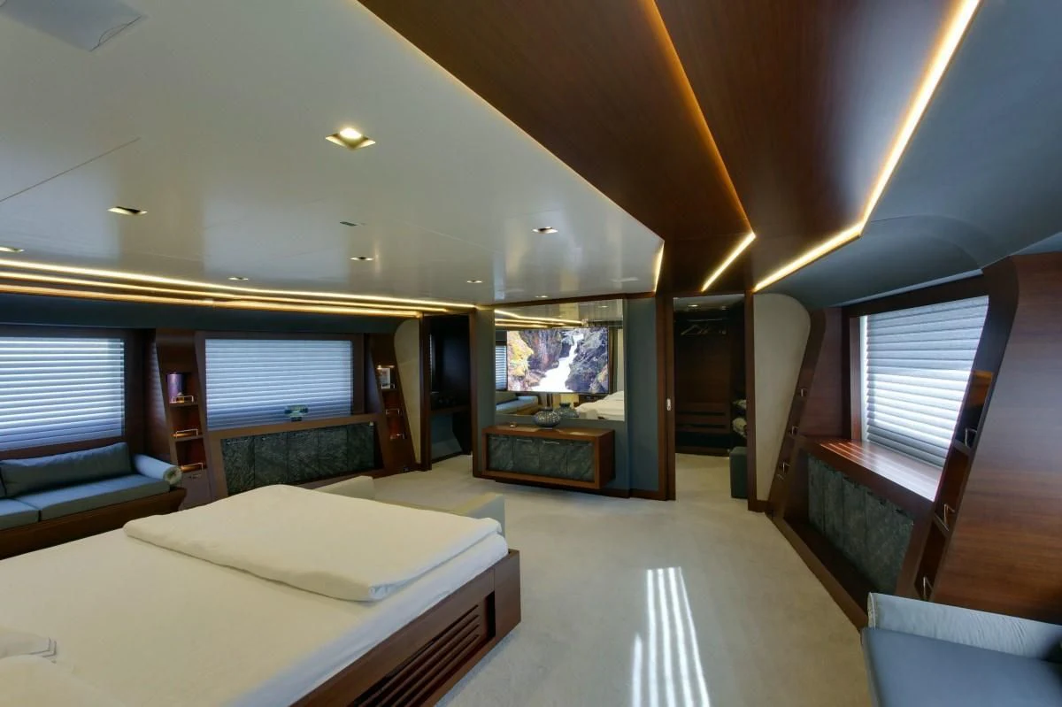 a bedroom with a large bed aboard BEBE Yacht for Sale