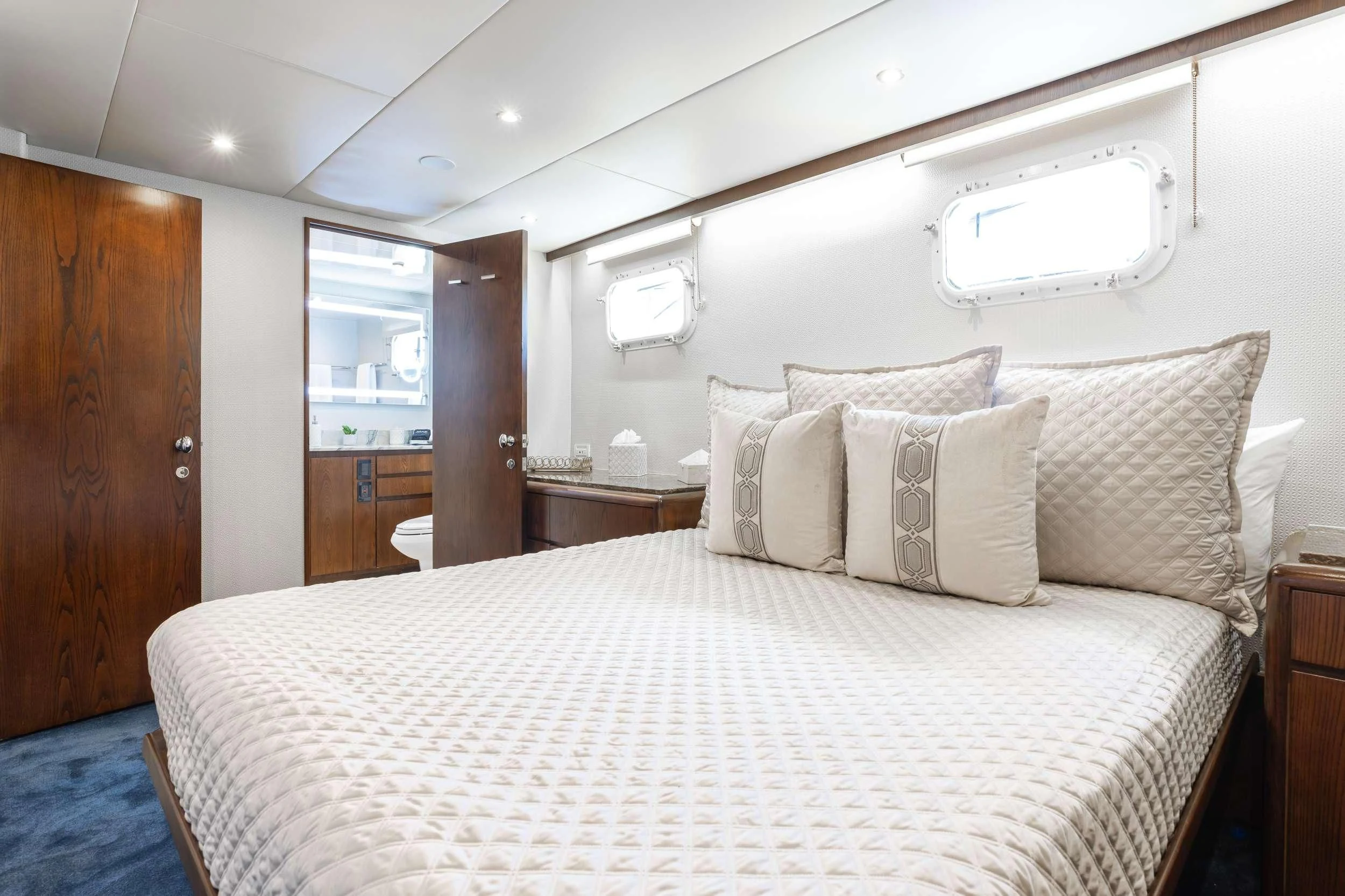 a bed with pillows aboard A PLACE IN THE SUN Yacht for Sale