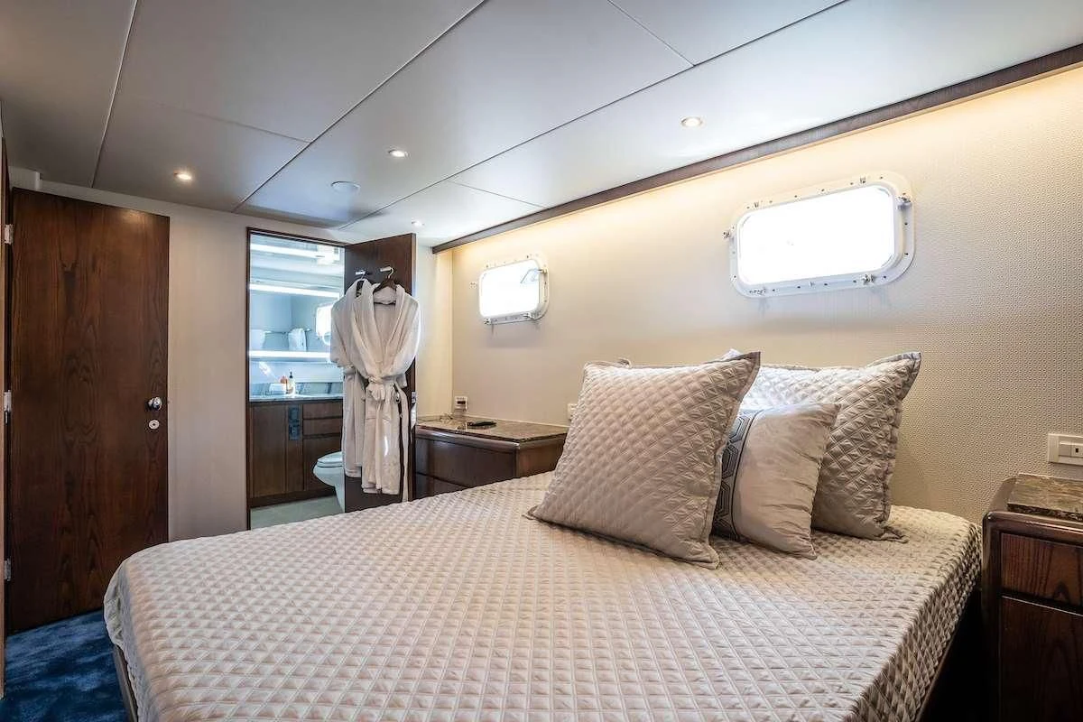 a bed in a hotel room aboard A PLACE IN THE SUN Yacht for Sale