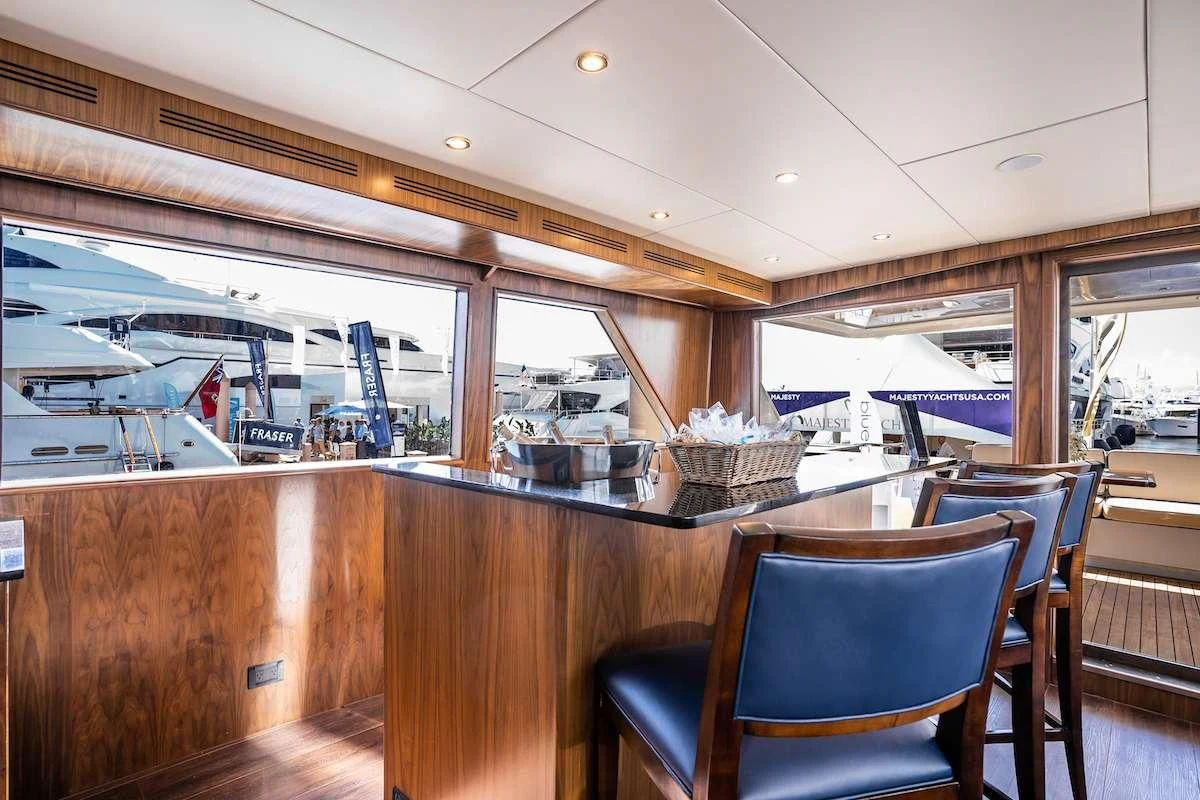 a room with a table and chairs aboard A PLACE IN THE SUN Yacht for Sale