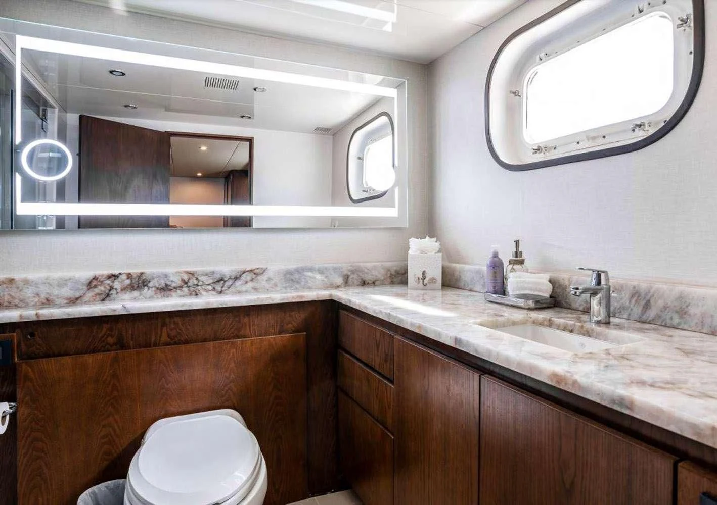 a bathroom with a sink and a toilet aboard A PLACE IN THE SUN Yacht for Sale