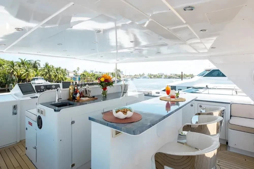 a kitchen with a table and chairs aboard A PLACE IN THE SUN Yacht for Sale
