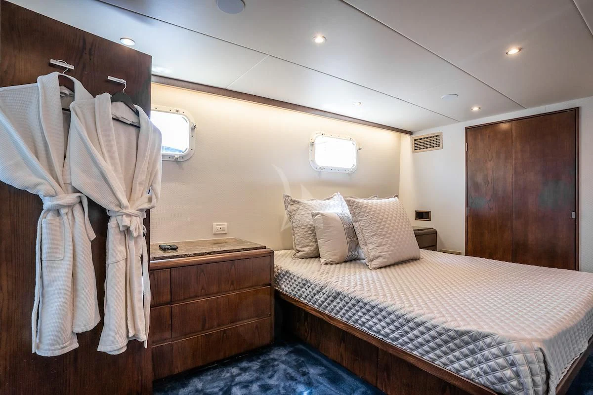 a bed in a hotel room aboard A PLACE IN THE SUN Yacht for Sale