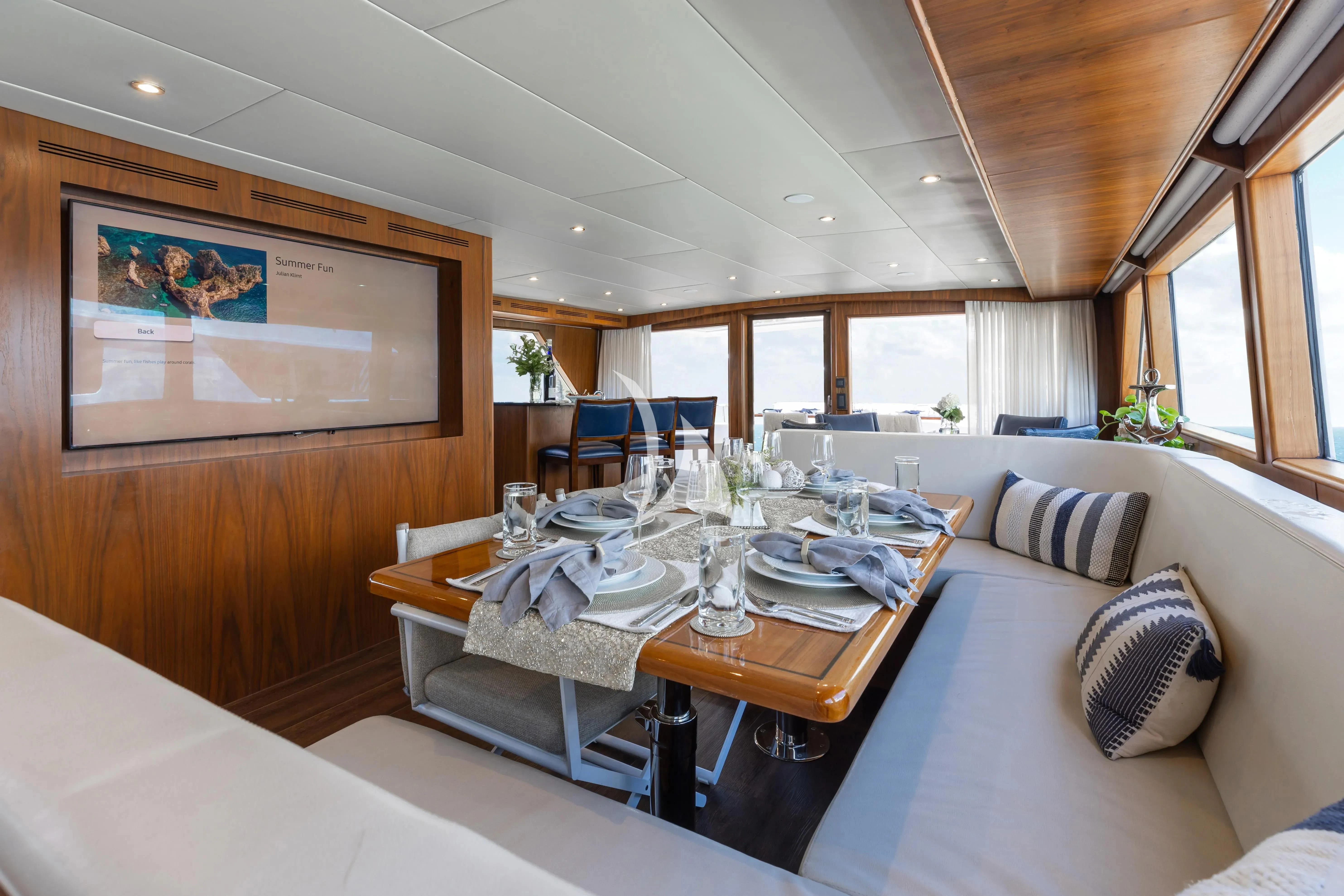 a dining table in a room aboard A PLACE IN THE SUN Yacht for Sale