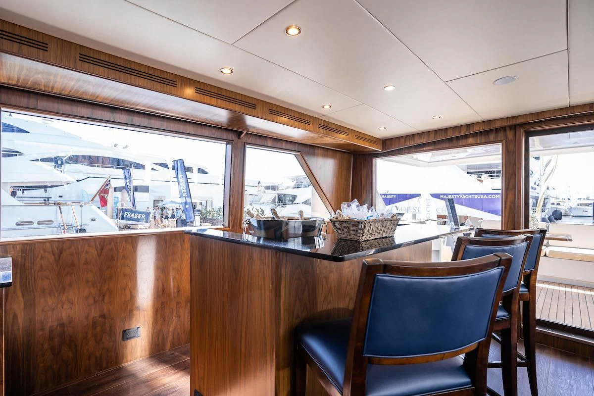 a room with a table and chairs aboard A PLACE IN THE SUN Yacht for Sale