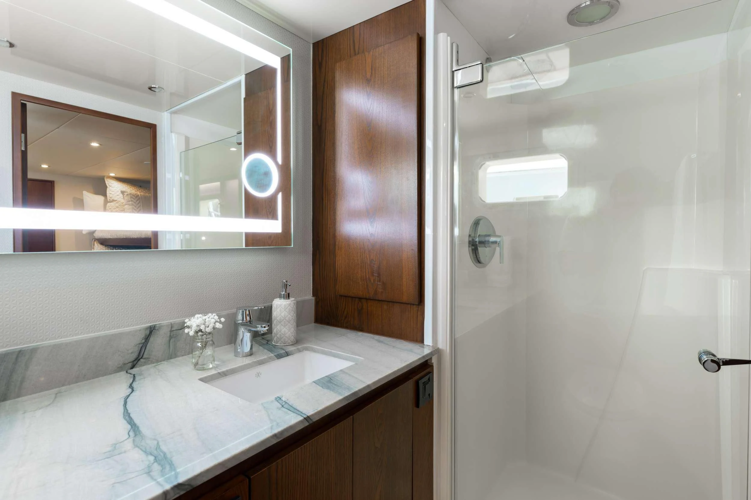 a bathroom with a sink and a shower aboard A PLACE IN THE SUN Yacht for Sale
