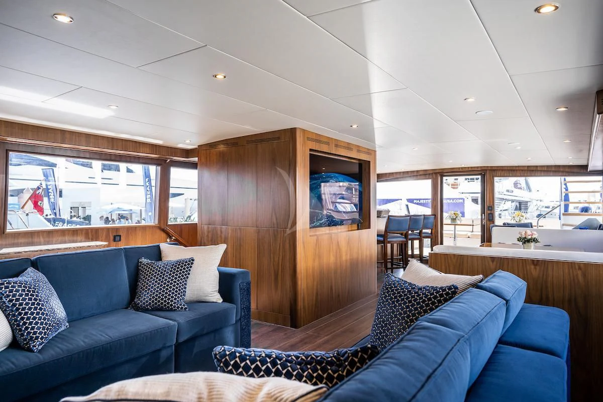 a living room with a wood wall aboard A PLACE IN THE SUN Yacht for Sale