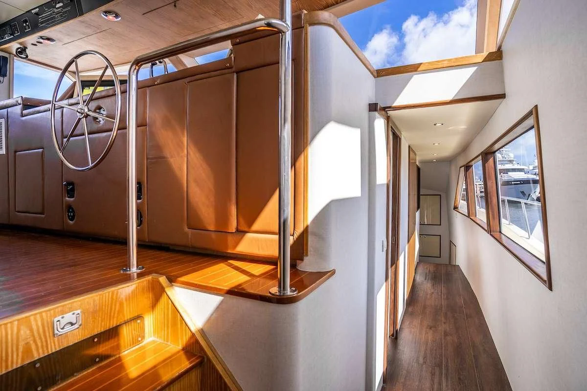 a room with a large metal staircase aboard A PLACE IN THE SUN Yacht for Sale