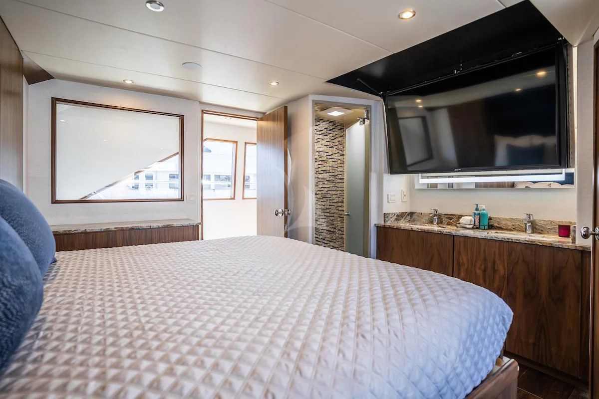 a bed in a room aboard A PLACE IN THE SUN Yacht for Sale