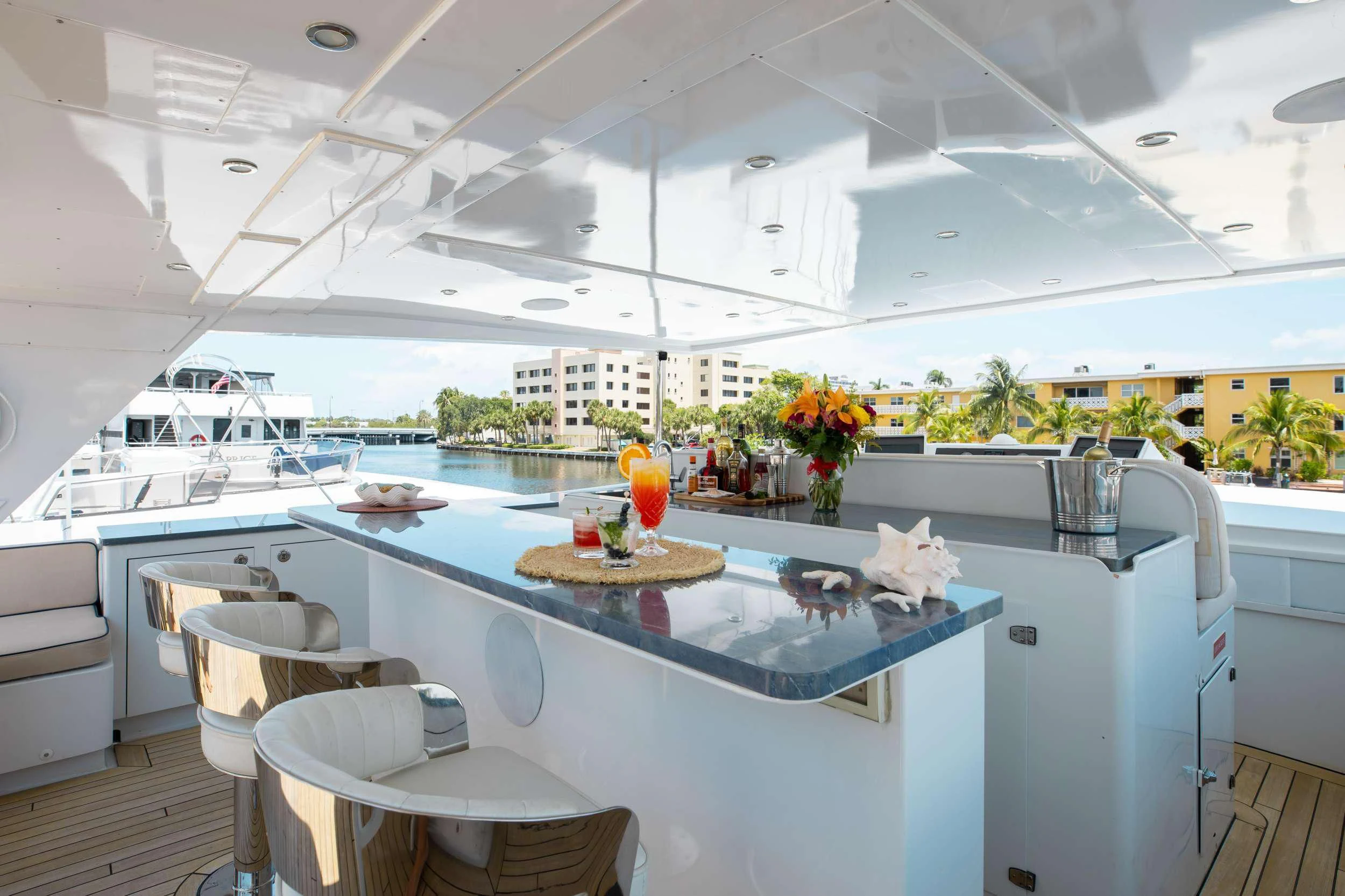 a kitchen with a table and chairs aboard A PLACE IN THE SUN Yacht for Sale