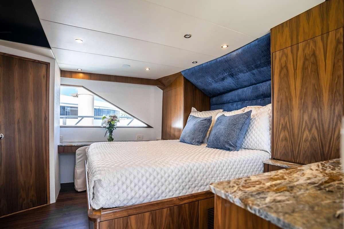 a bed in a room aboard A PLACE IN THE SUN Yacht for Sale