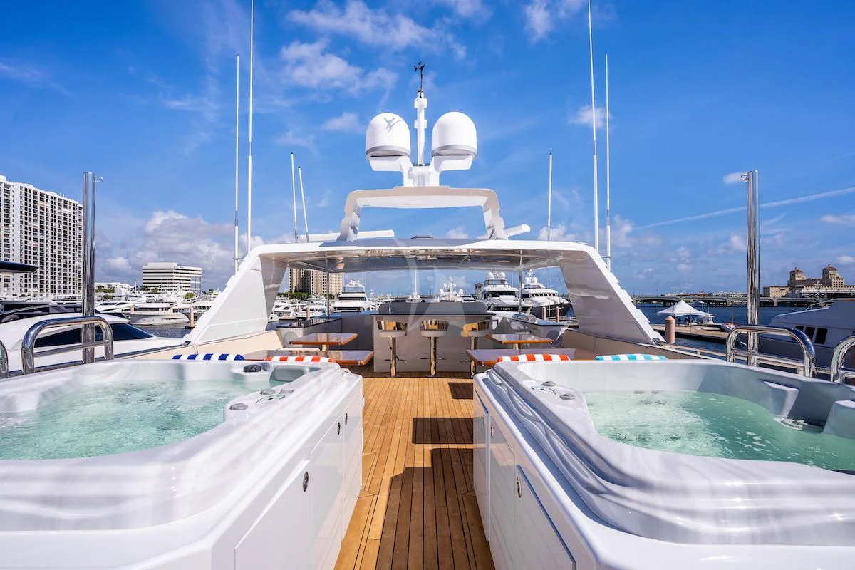 a large white ship docked aboard A PLACE IN THE SUN Yacht for Sale