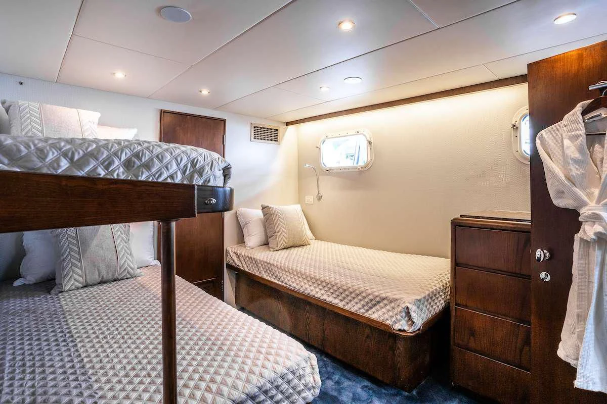 a couple of beds in a hotel room aboard A PLACE IN THE SUN Yacht for Sale