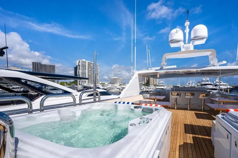 a large cruise ship docked aboard A PLACE IN THE SUN Yacht for Sale