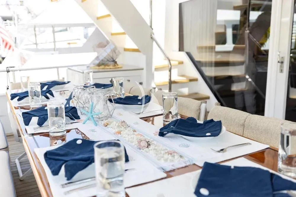 a table with glasses and napkins aboard A PLACE IN THE SUN Yacht for Sale