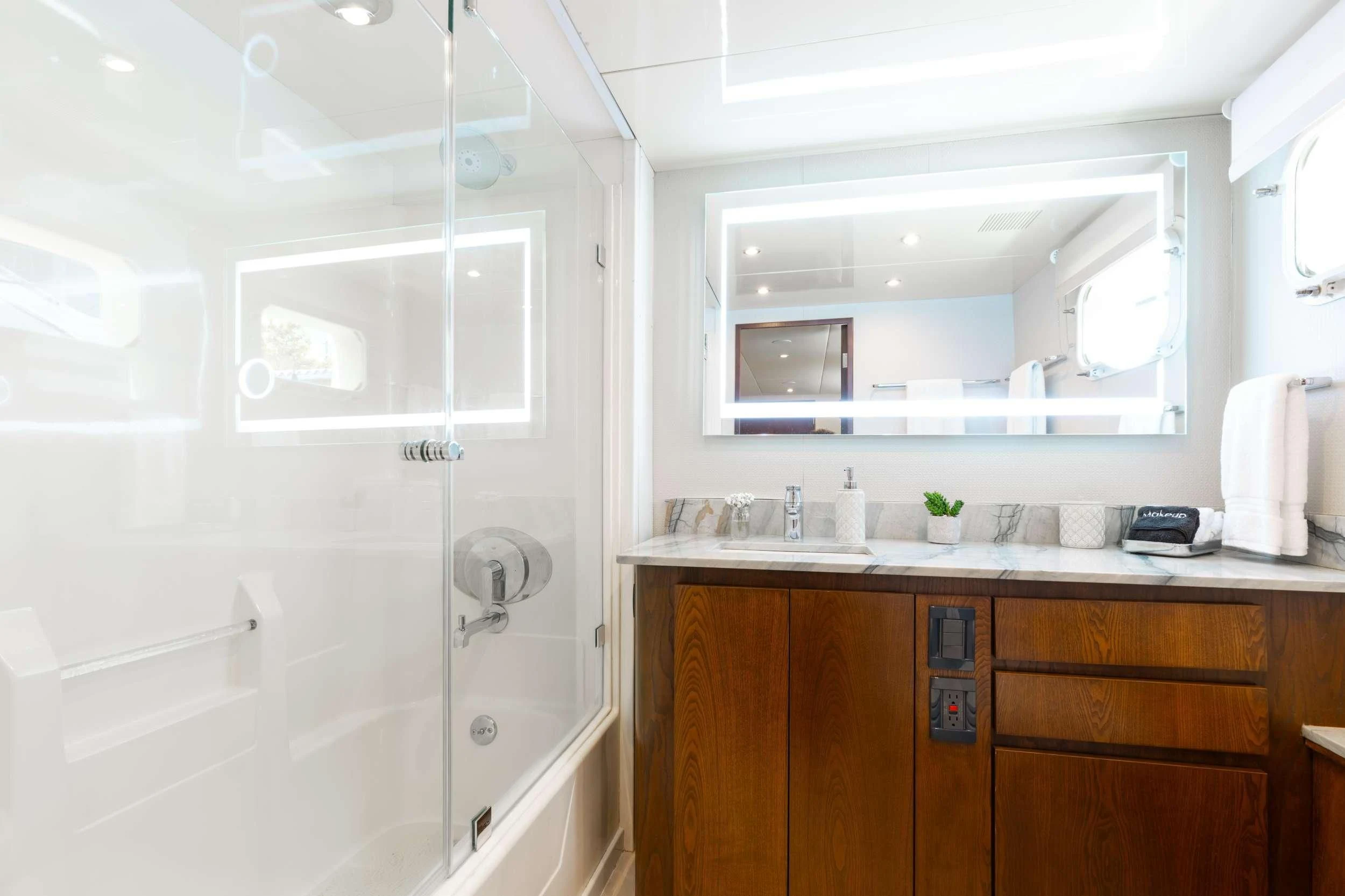 a bathroom with a sink and cabinets aboard A PLACE IN THE SUN Yacht for Sale