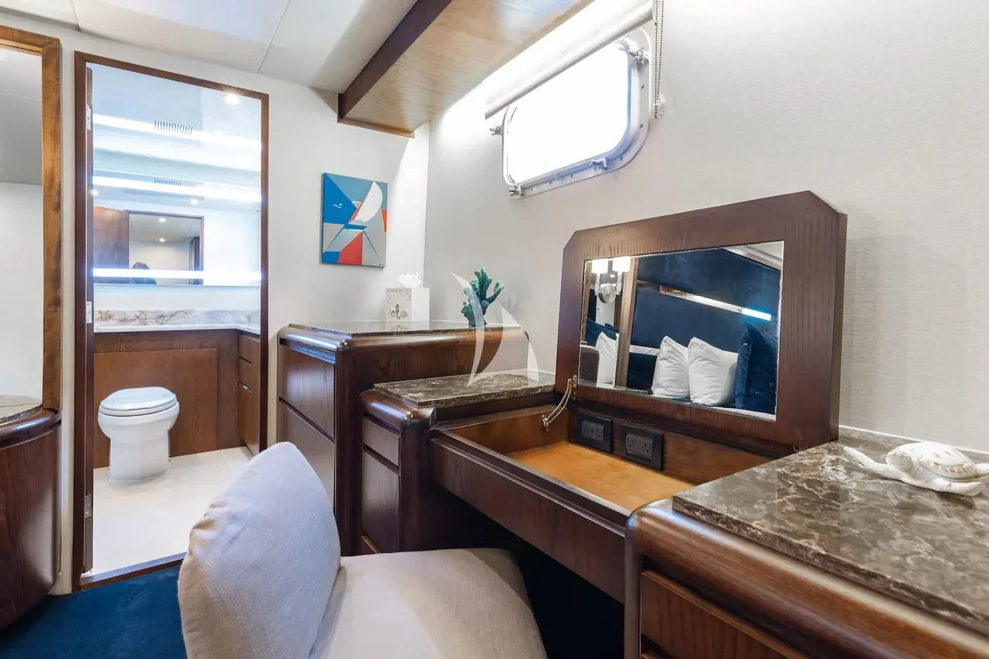 a room with a desk and a chair aboard A PLACE IN THE SUN Yacht for Sale