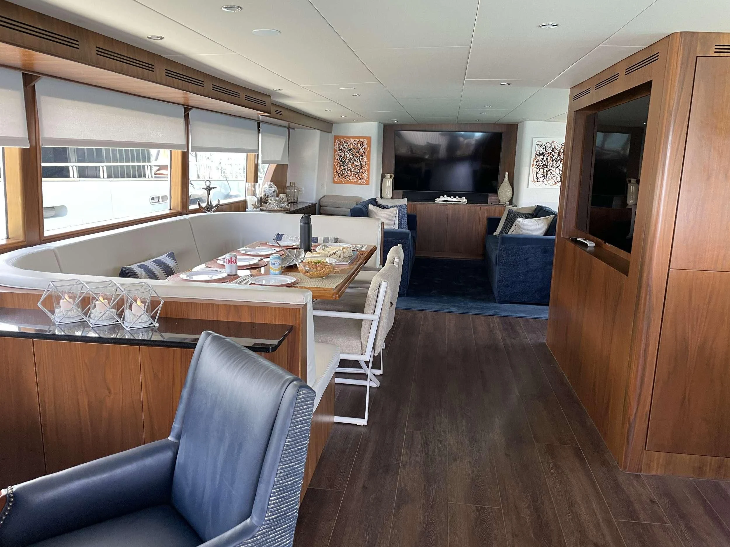 a kitchen with a table and chairs aboard A PLACE IN THE SUN Yacht for Sale