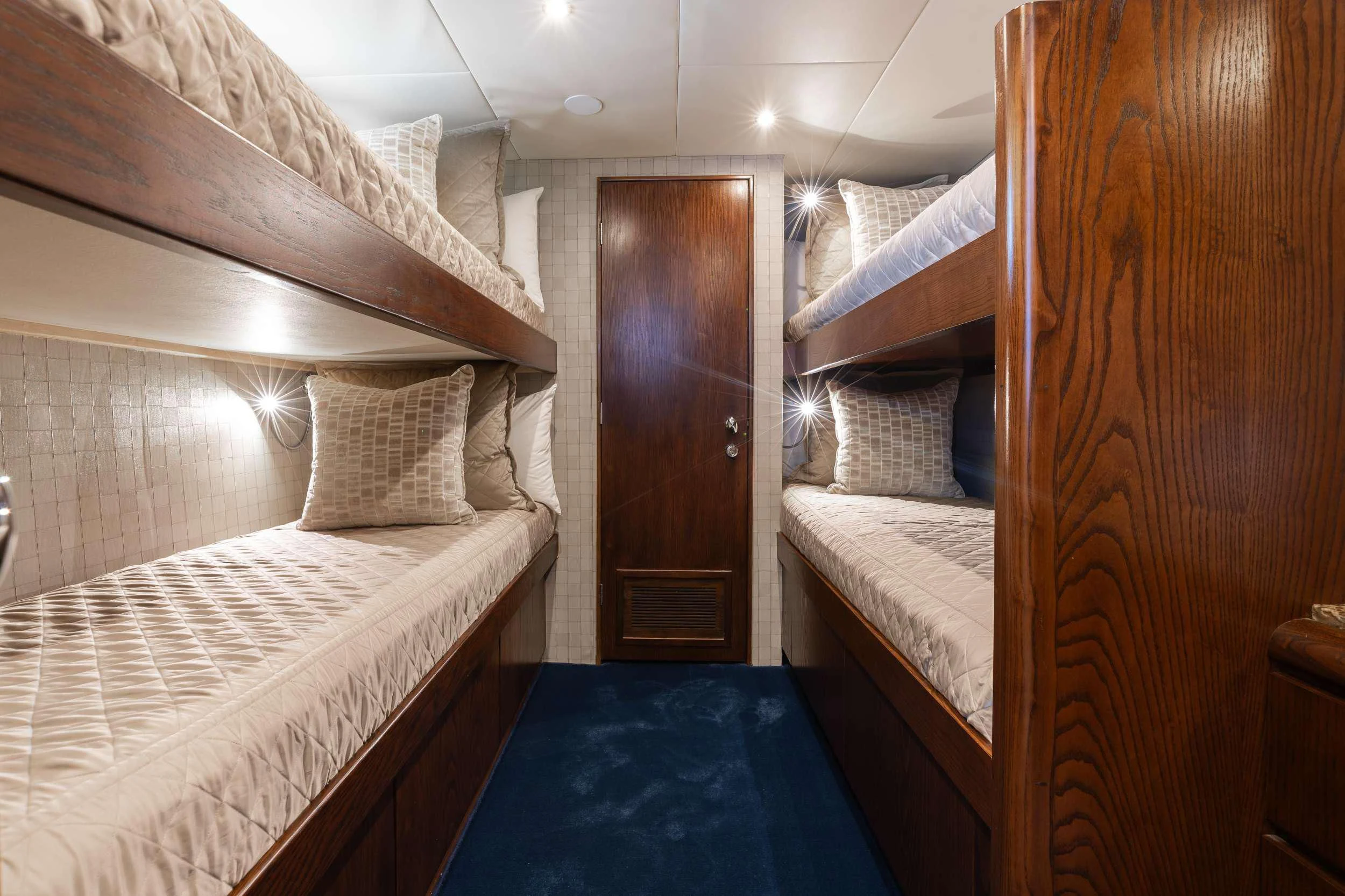 a room with bunk beds aboard A PLACE IN THE SUN Yacht for Sale
