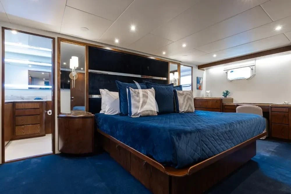 a bed in a room aboard A PLACE IN THE SUN Yacht for Sale