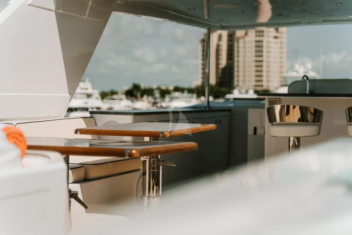 a room with a table and chairs aboard A PLACE IN THE SUN Yacht for Sale