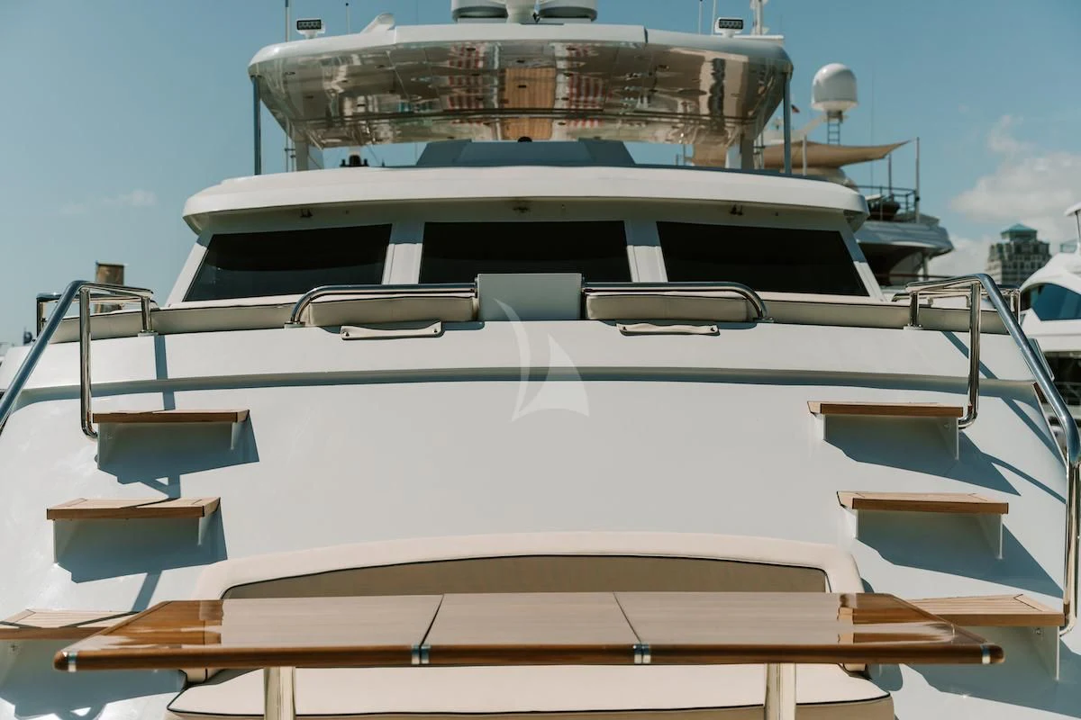 a boat with a large ship in the background aboard A PLACE IN THE SUN Yacht for Sale