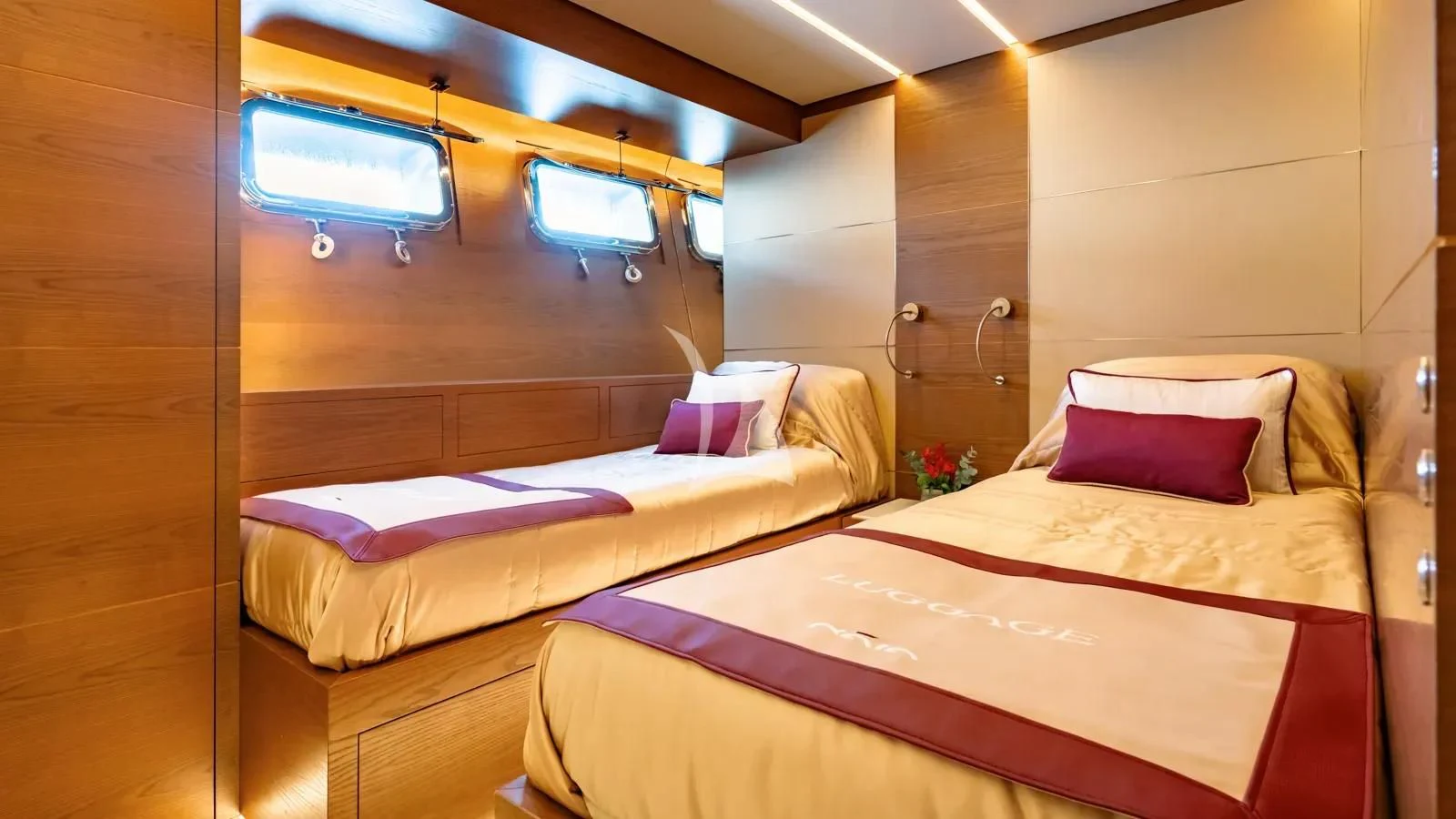 a couple of beds in a room aboard NAIA Yacht for Sale