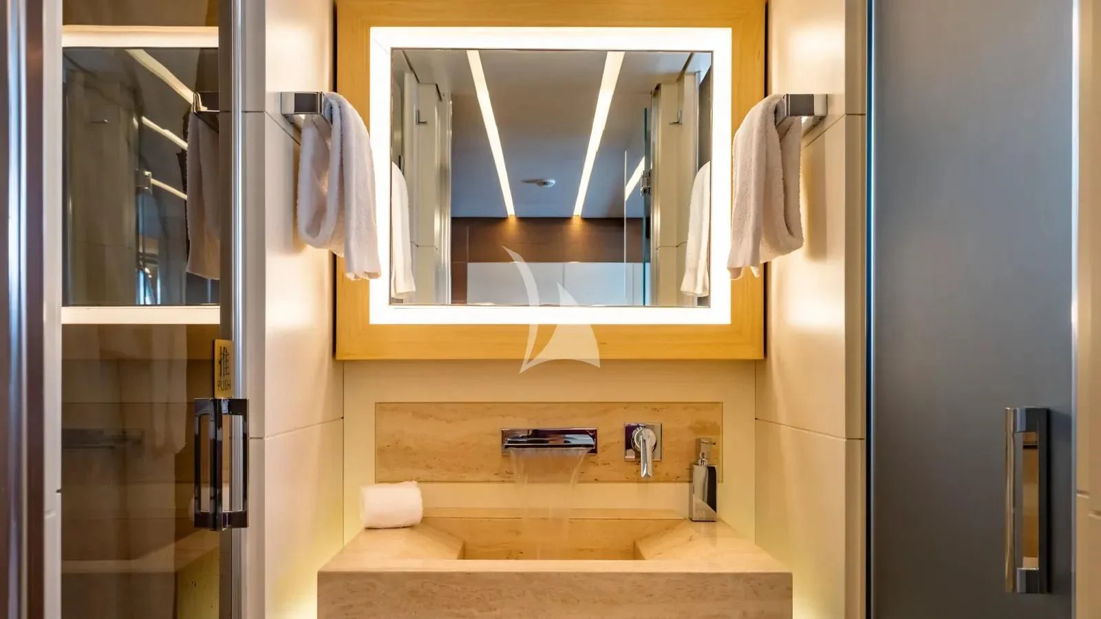 a bathroom with a large mirror aboard NAIA Yacht for Sale