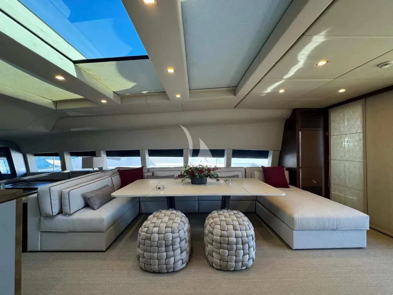 a modern looking living room aboard NAIA Yacht for Sale