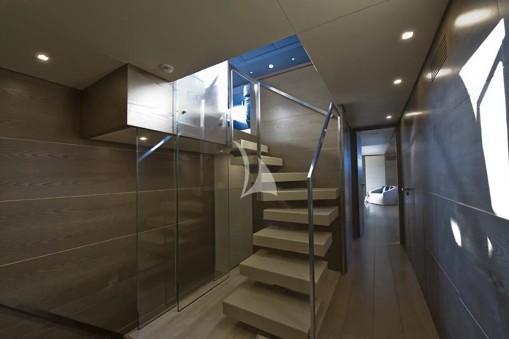 a large metal staircase in a building aboard NAIA Yacht for Sale
