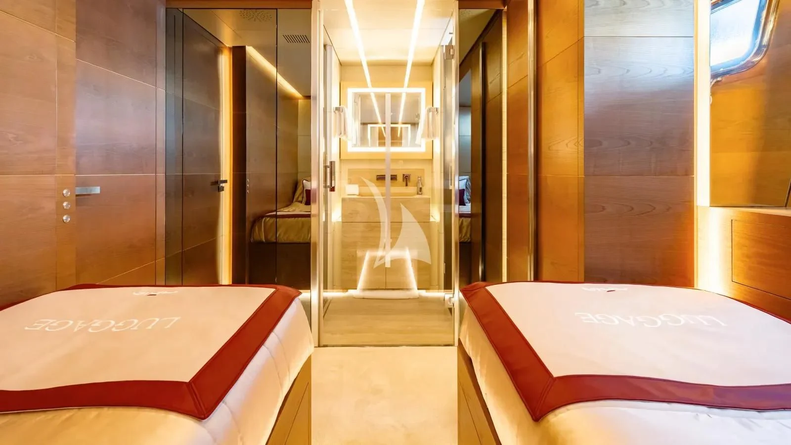 a room with a bed and a door aboard NAIA Yacht for Sale