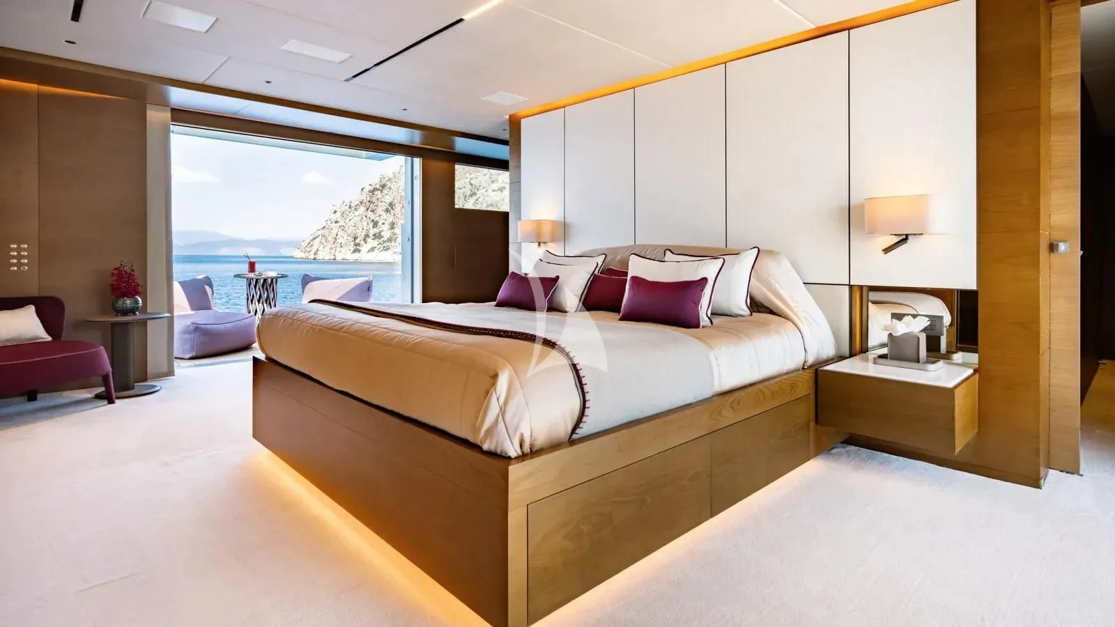 a large bed in a room aboard NAIA Yacht for Sale