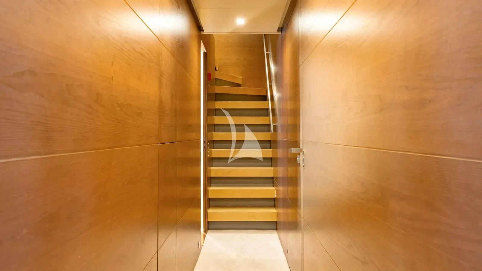 a hallway with a glass door aboard NAIA Yacht for Sale