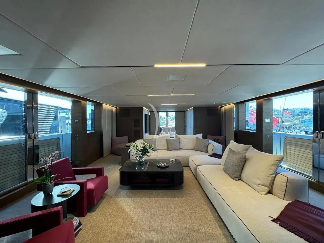 a living room with a couch and a table aboard NAIA Yacht for Sale