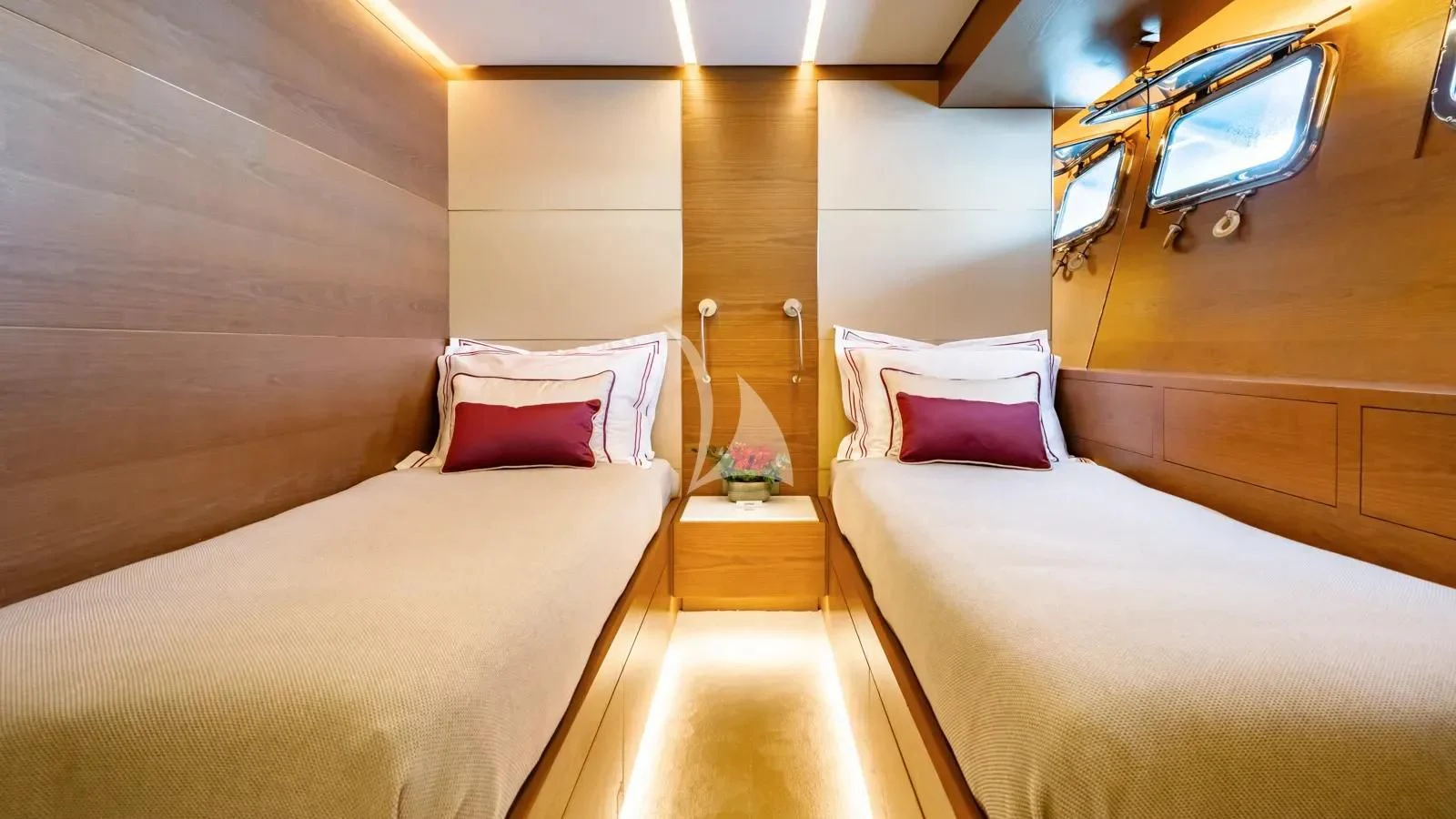 a room with a bed and a television aboard NAIA Yacht for Sale