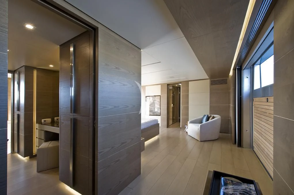 a room with a large glass wall aboard NAIA Yacht for Sale