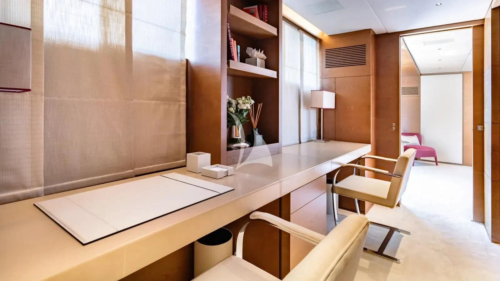 a room with a table and chairs aboard NAIA Yacht for Sale