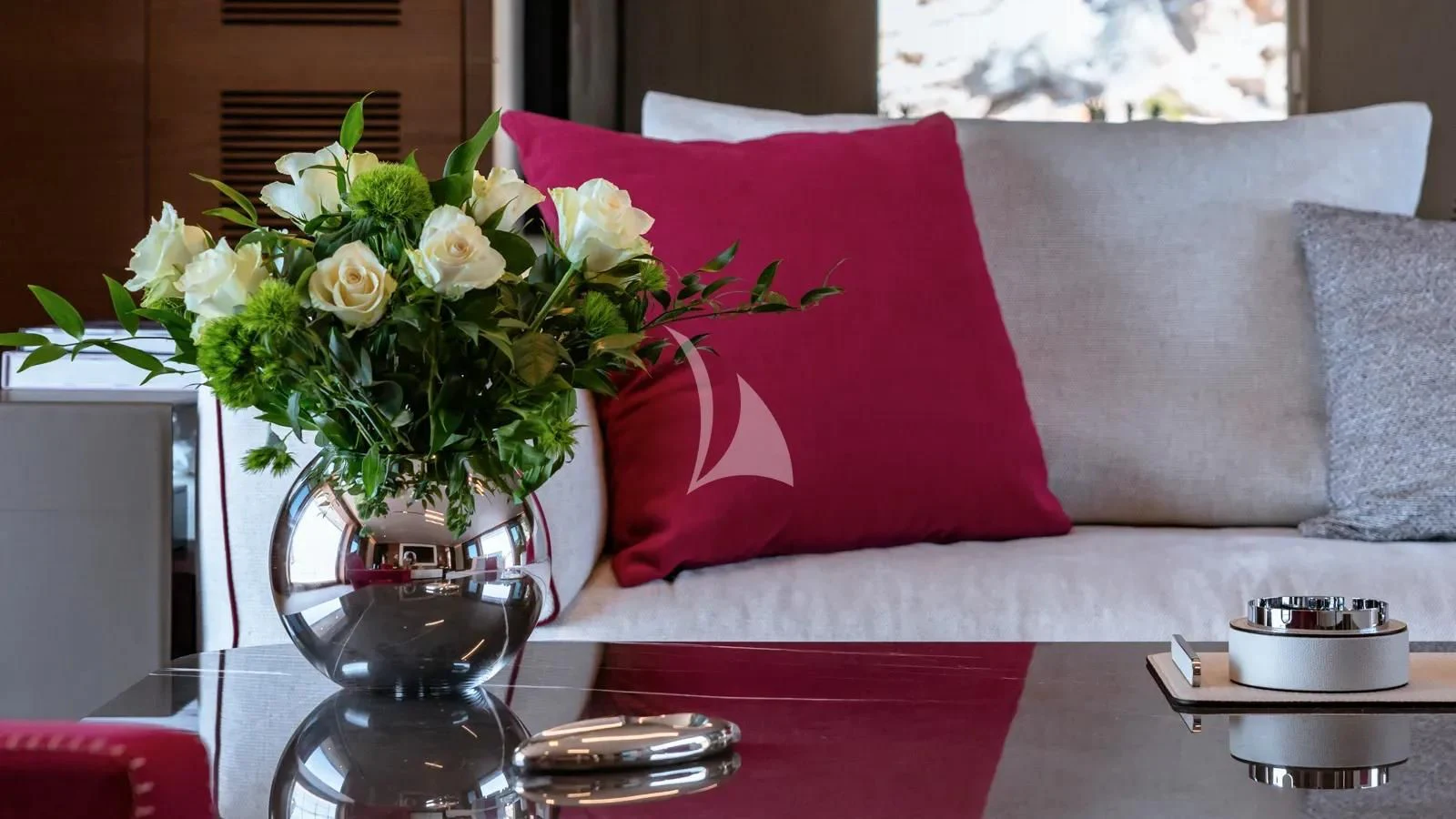 a vase of flowers on a table aboard NAIA Yacht for Sale