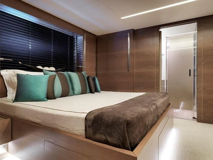 a bed in a room aboard NAIA Yacht for Sale