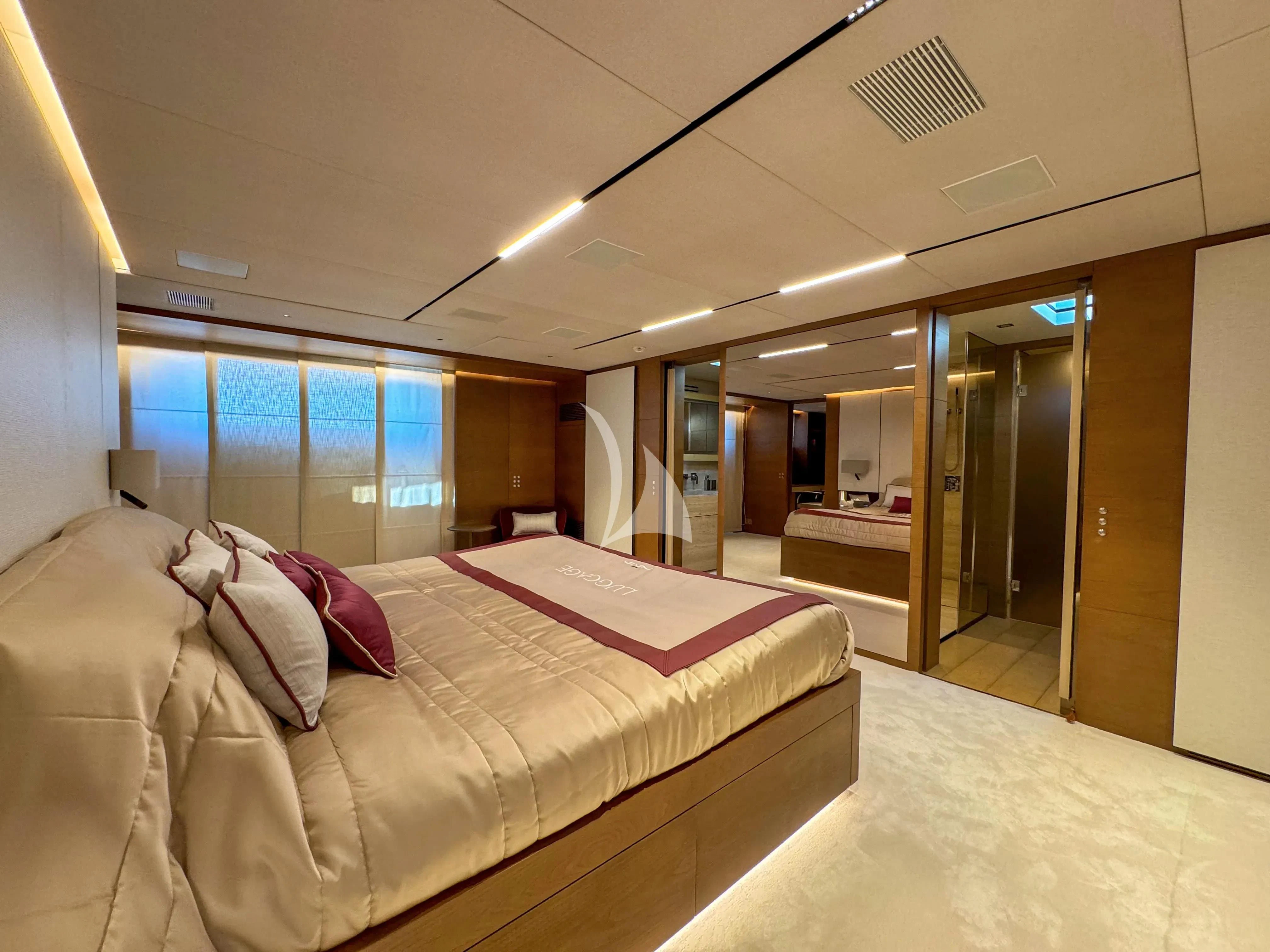 a large bed in a room aboard NAIA Yacht for Sale