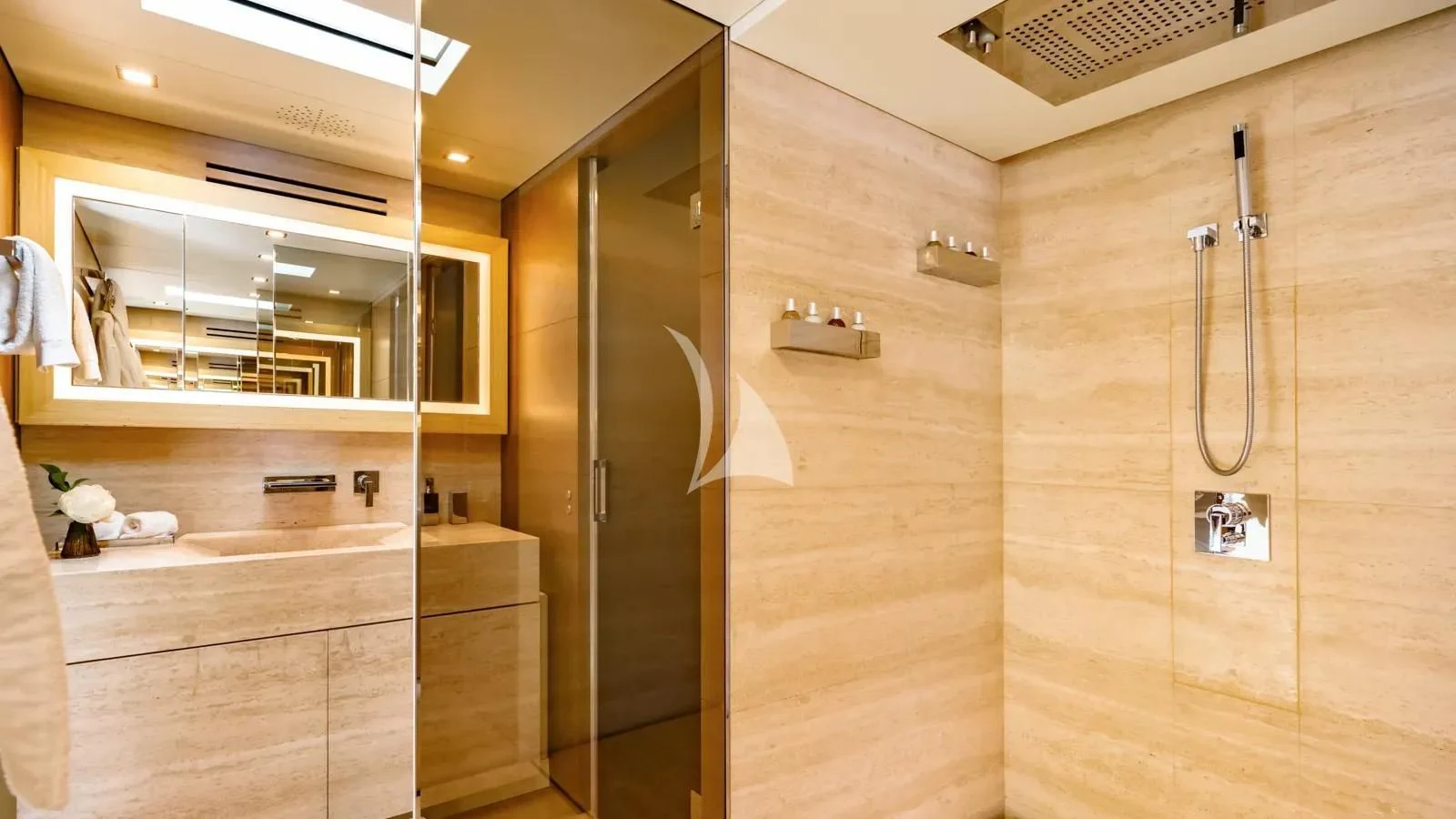 a bathroom with a shower unit and a sink aboard NAIA Yacht for Sale
