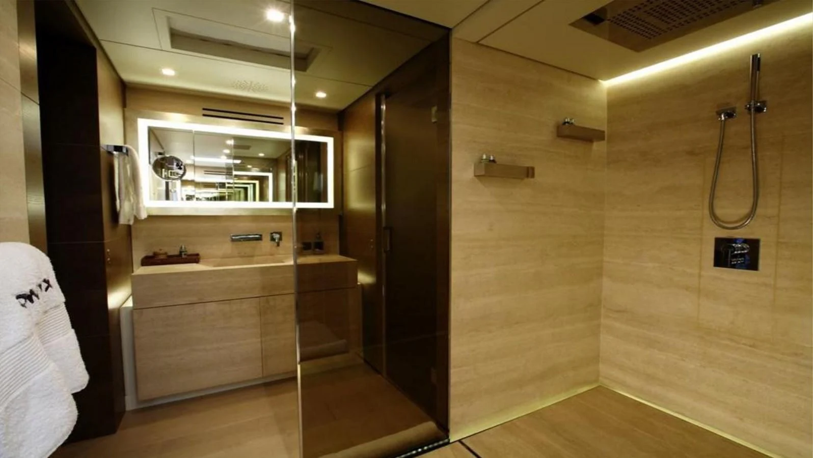 a bathroom with a glass shower aboard NAIA Yacht for Sale