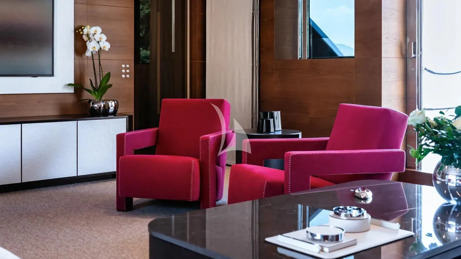 a room with a table and chairs aboard NAIA Yacht for Sale