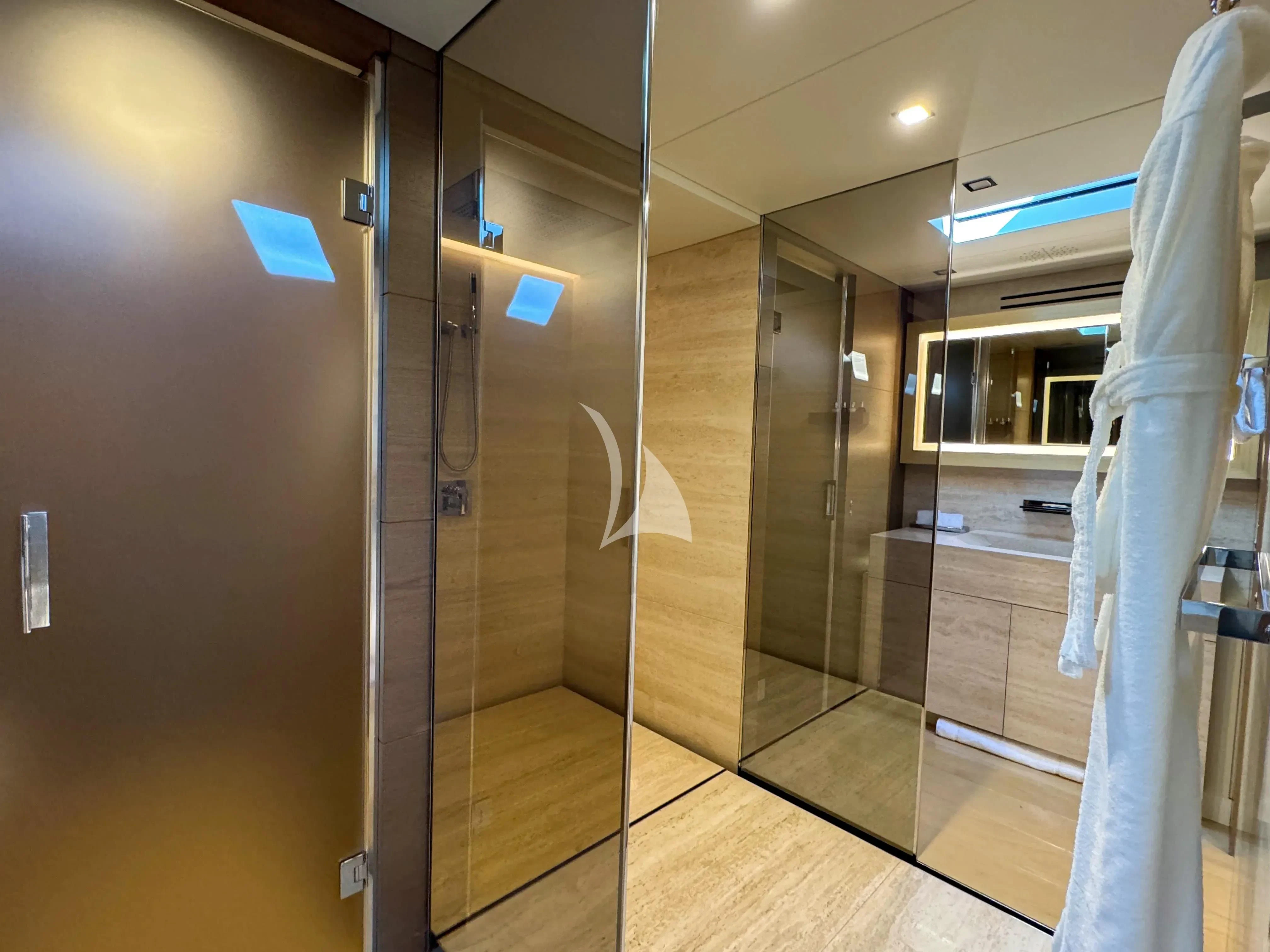 a room with a glass door aboard NAIA Yacht for Sale