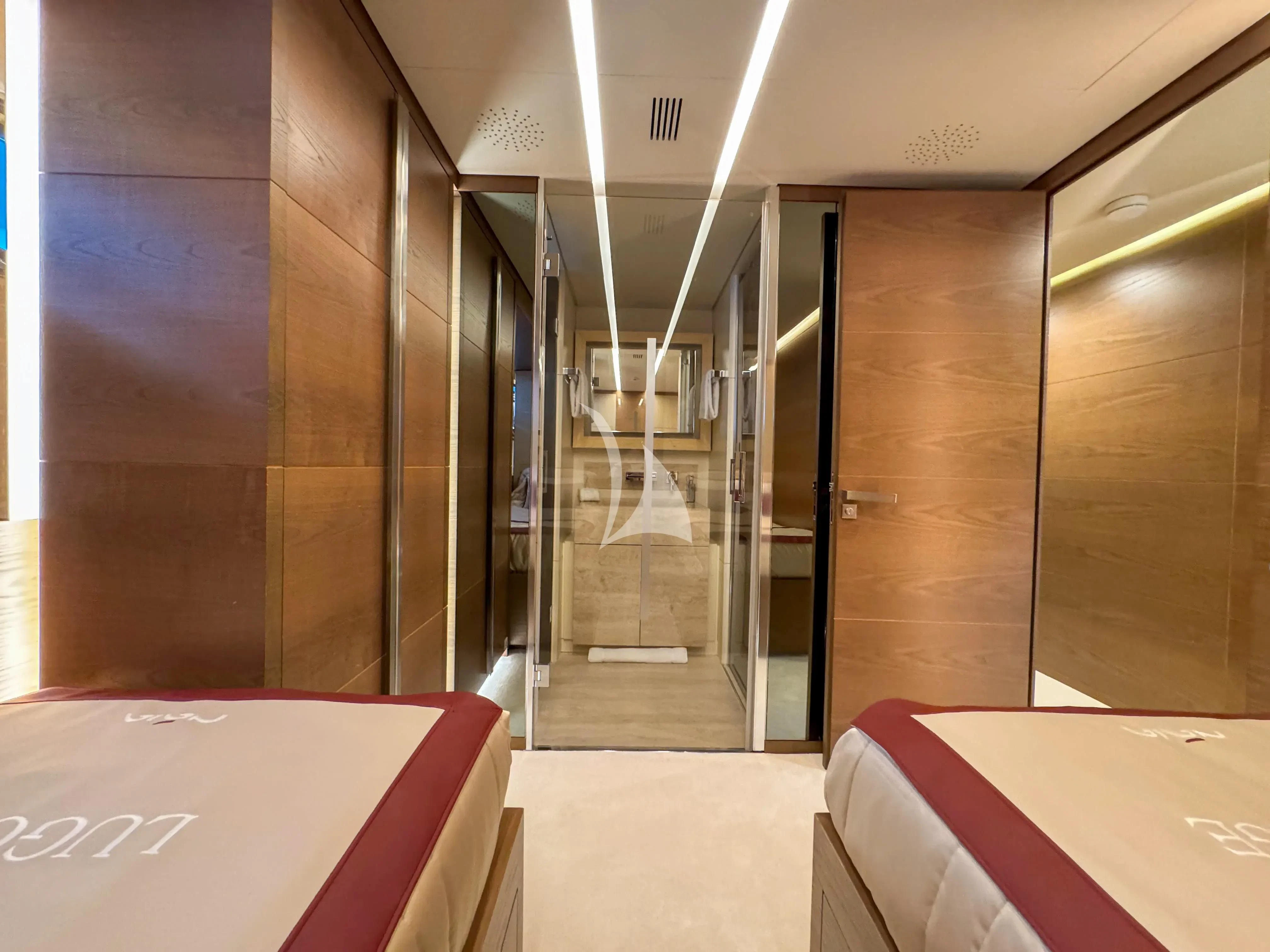 a room with a glass wall aboard NAIA Yacht for Sale