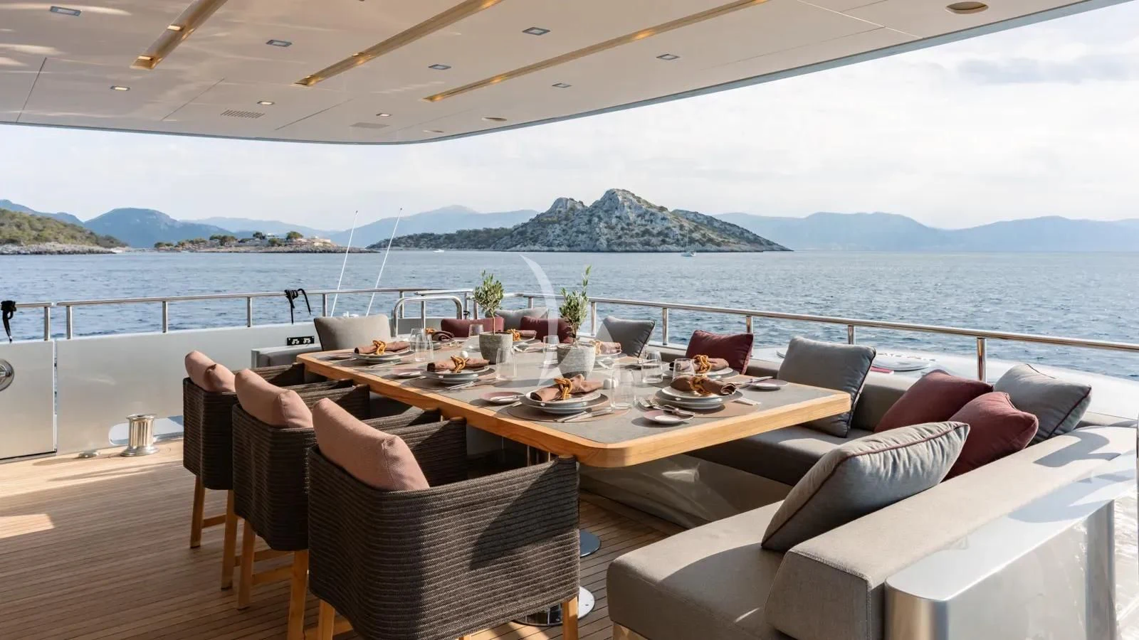 a table with chairs on it aboard NAIA Yacht for Sale