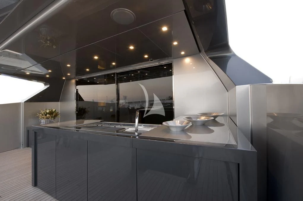 a kitchen with a large island aboard NAIA Yacht for Sale